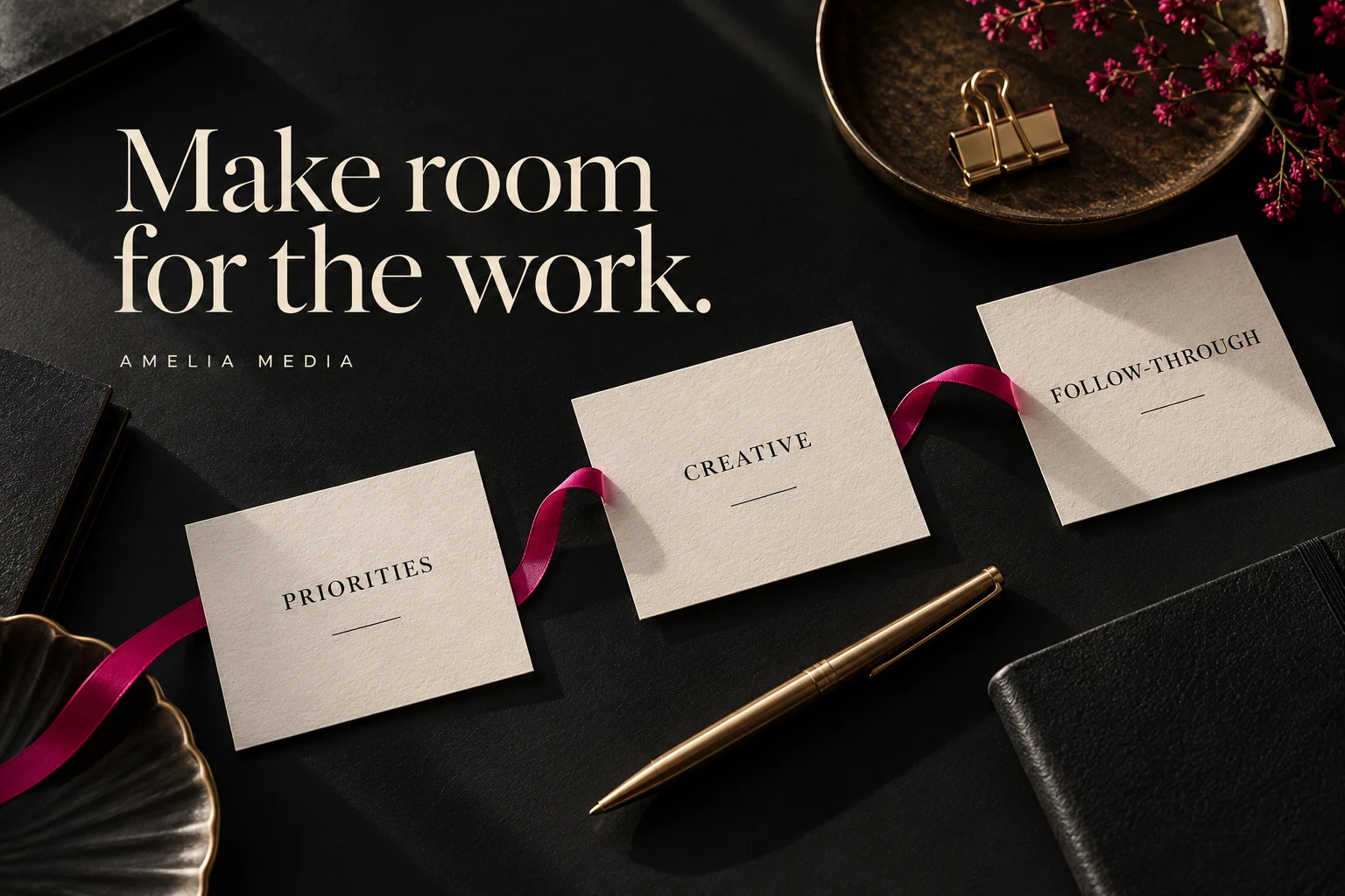 Cream planning cards labeled priorities, creative, and follow-through on a black desk with magenta ribbon and gold details.